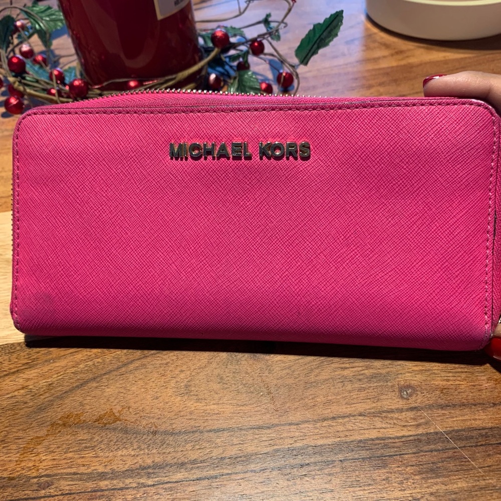 Michael kors hot pink wallet.